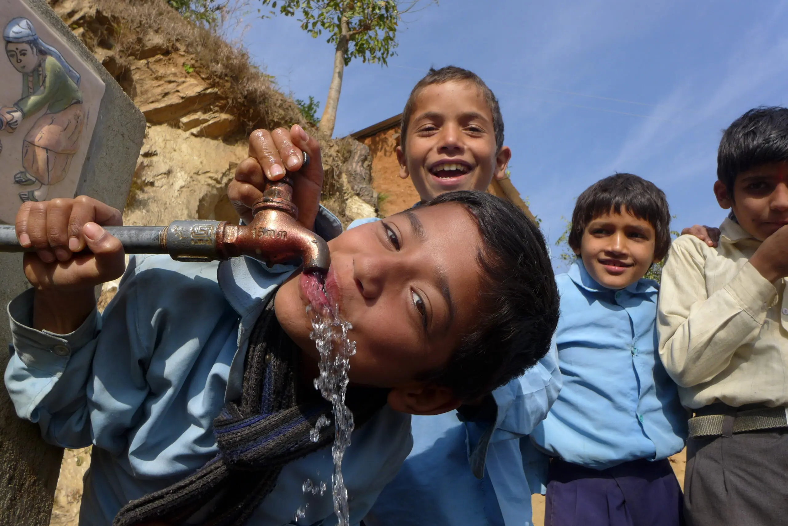 Kids at water spout.
