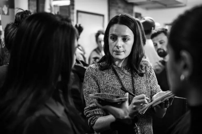 Block Club Chicago reporter Molly DeVore interviews after a press conference after federal agents pulled a teacher from inside Rayito de Sol, a North Center daycare, Wednesday morning on Nov. 5, 2025.
