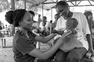 Doctor helping child